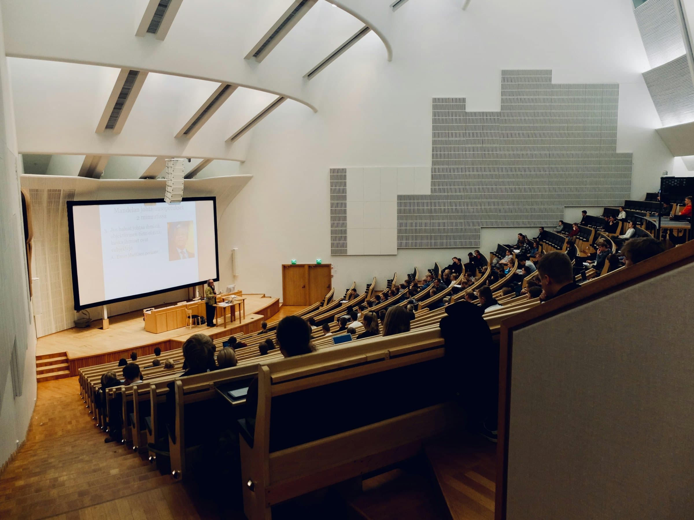 Tiered lecture theatre with acoustic ceiling panels